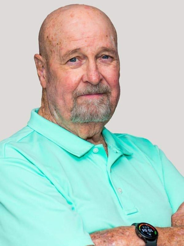 Bob Mellifont, sales expert with over 45 years of experience, leading a sales consulting team.